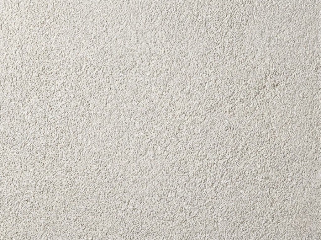 Close-up van korrelcrepi structuur op een gevel